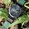 Army Green nylon QuickFit watch band and Garmin watch among green leaves