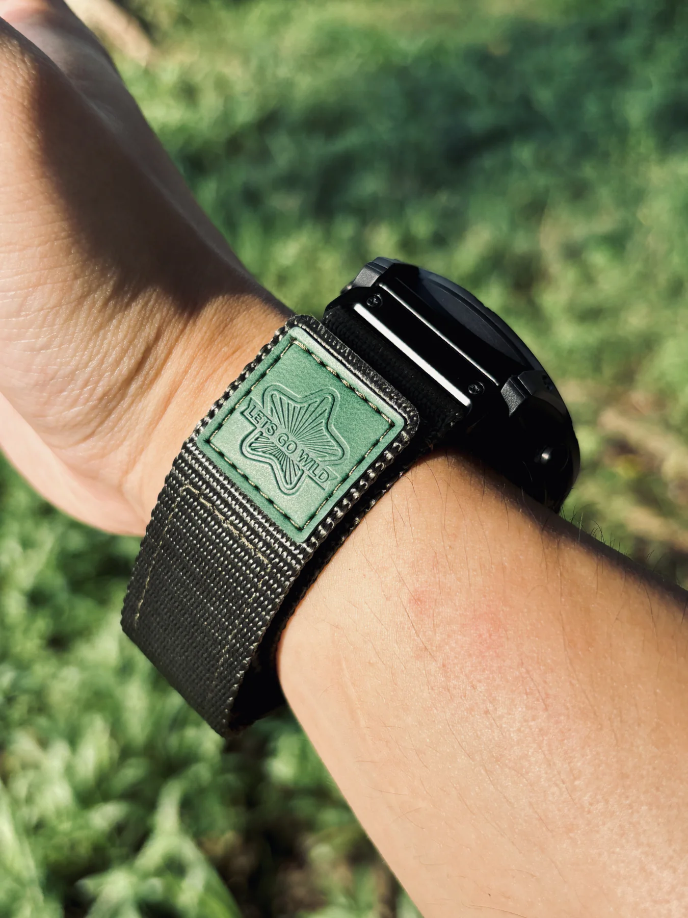 Army Green nylon QuickFit watch band wrapped securely around a wrist