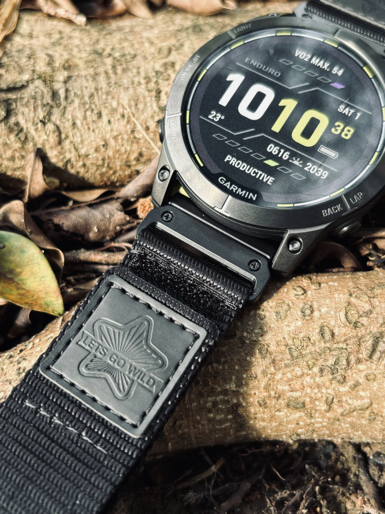Close view of the black nylon band, HEMSUT patch and QuickFit connector on a Garmin watch