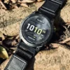 Black nylon QuickFit watch band and Garmin watch resting on a rock outdoors