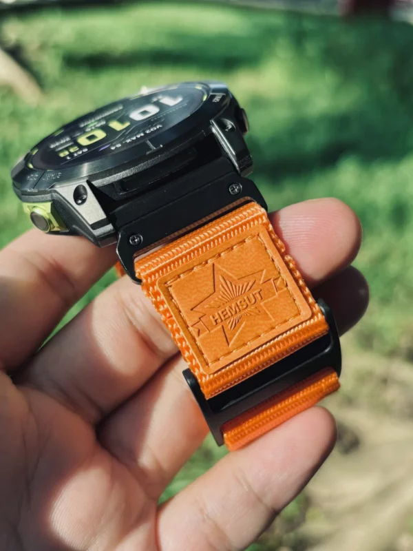 Close view of the orange nylon loop closure and black QuickFit connector