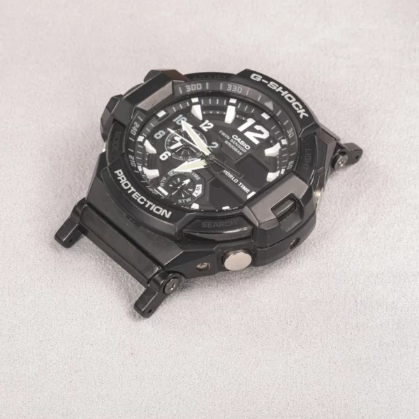 Detail view of black adapter connectors installed on a G-SHOCK GA-1100 watch without a strap