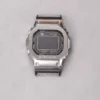 Front view of black adapter connectors installed on a G-SHOCK GMW-B5000 watch without a strap