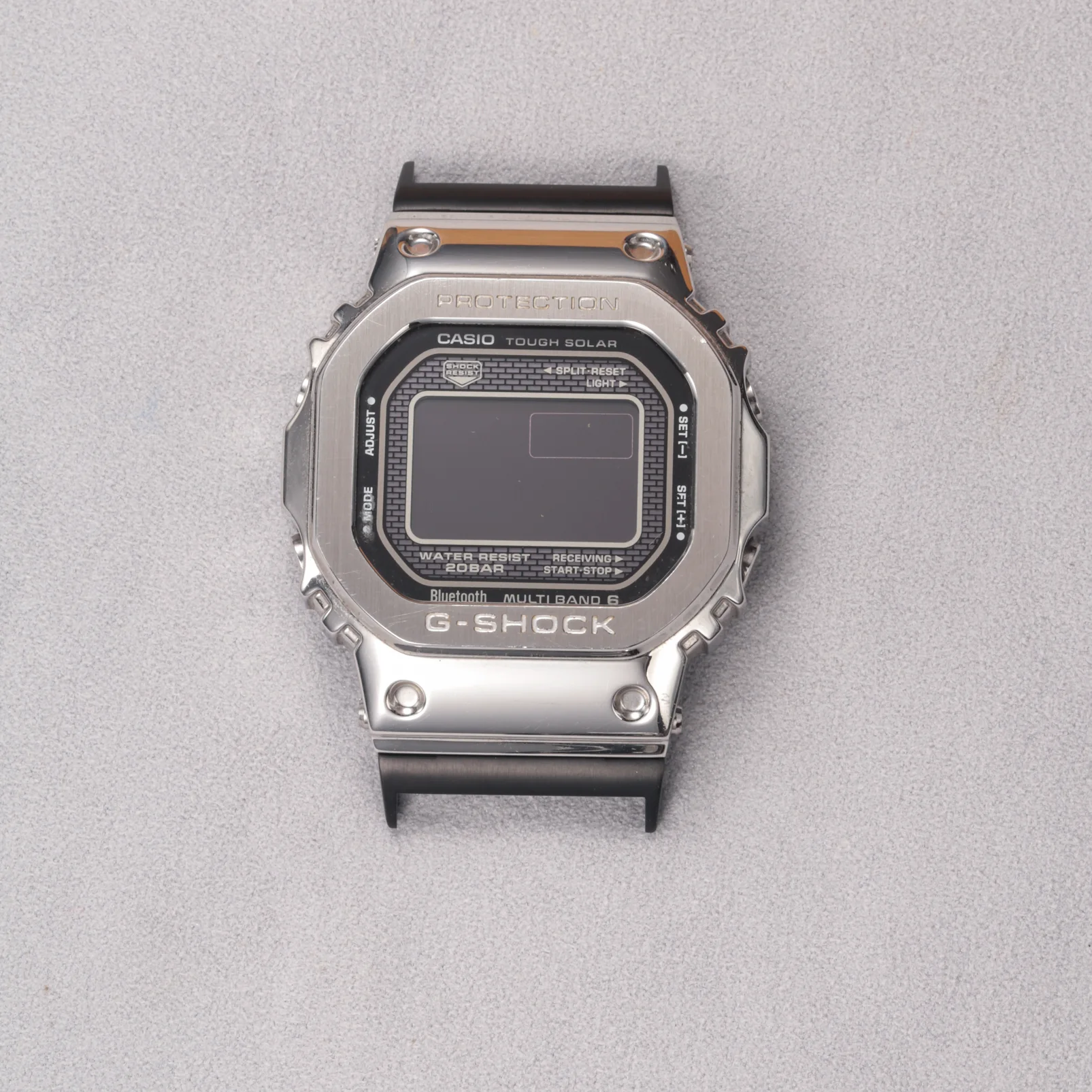 Black adapter connectors installed on a G-SHOCK GMW-B5000 watch without a strap