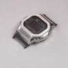 Angled view of black adapter connectors installed on a G-SHOCK GMW-B5000 watch without a strap