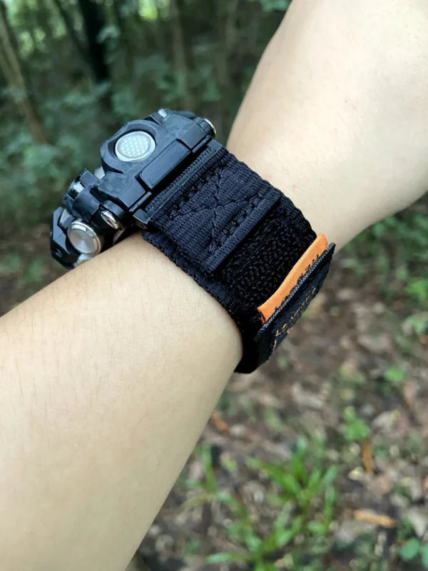 hg155-gwg2000-black-orange-03-installed-detail Close view of the Black Orange nylon strap connection on a G-SHOCK GWG-2000