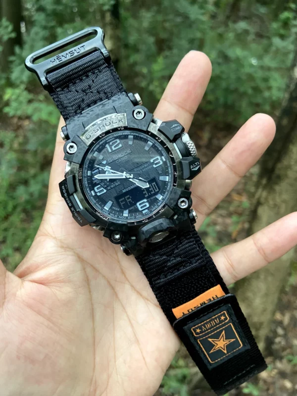 hg155-gwg2000-black-orange-04-hand-front Black Orange HEMSUT nylon Velcro-style watch band and G-SHOCK GWG-2000 held outdoors