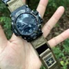 hg155-gwg2000-coyote-05-hand-display Coyote HEMSUT nylon Velcro-style watch band and G-SHOCK GWG-2000 held outdoors
