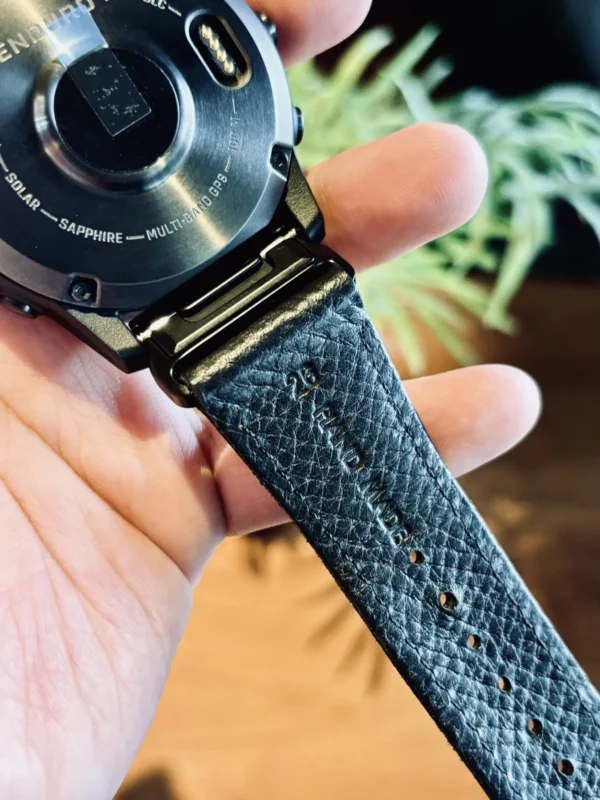 hga160-garmin-badalassi-carlo-black-leather-holes-detail Close view of the black Italian leather grain stitching and adjustment holes