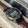 hga160-garmin-badalassi-carlo-burgundy-outdoor-stone Garmin watch with burgundy Italian leather strap placed outdoors on stone