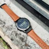hga160-garmin-badalassi-carlo-cognac-brown-outdoor-flat-lay Garmin watch with Cognac Brown Badalassi Carlo strap placed outdoors on stone